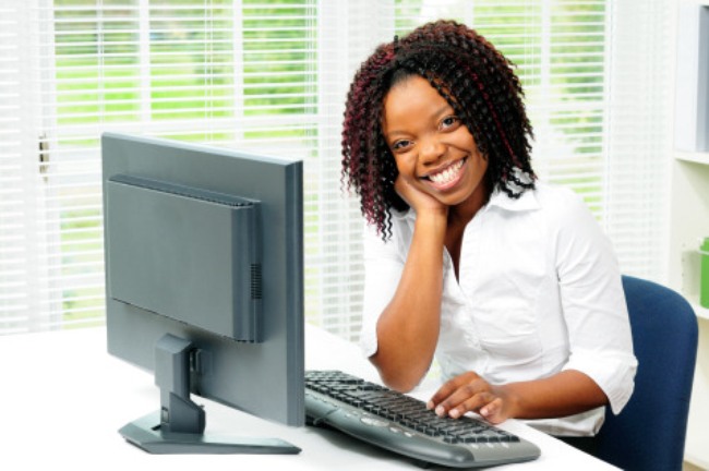 pretty-woman-working-on-computer-at-her-desk