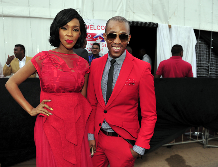 DURBAN, SOUTH AFRICA – JULY 5: Nhlanhla Nciza and Theo Kgosinkwe of Mafikizolo at the Vodacom Durban July 2014 on July 5, 2014 in Durban, South Africa. The Durban July is the Africa’s biggest horse-racing event where racegoers get to show off their colourful creations. This year’s theme was ‘Big Screen’. (Photo by Gallo Images / City Press / Lucky Nxumalo)